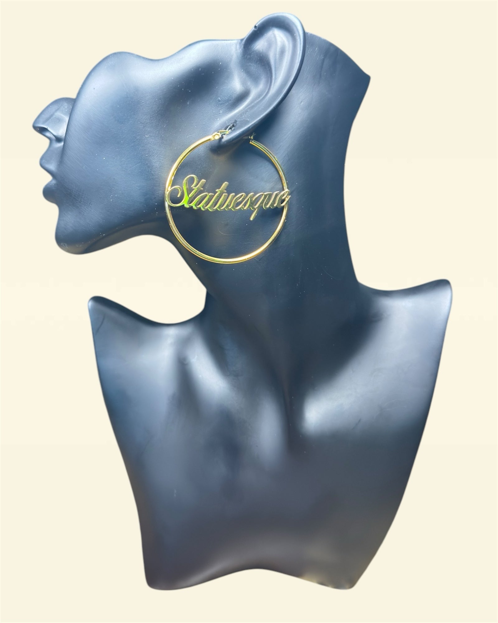 Display of gold tall girl hoop earrings